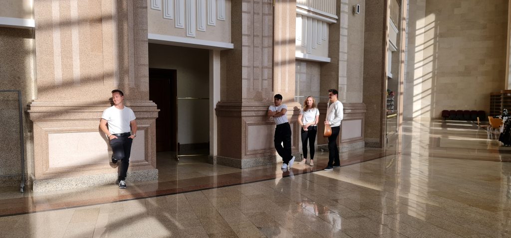 Richie Robot Steighner, Dovran Shammyyev, Kate Bass, Shobet Annamyradov posing at the Makam Palace in Ashgabat Turkmenistan filming I'll Remember You (Father/Son)