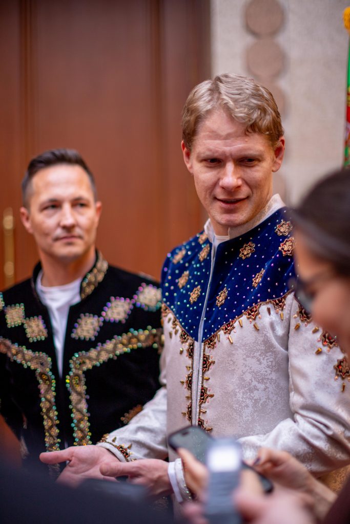 Aaron Young interview in Turkmenistan with Richie Robot Steighner in the background both in special Turkmen jackets